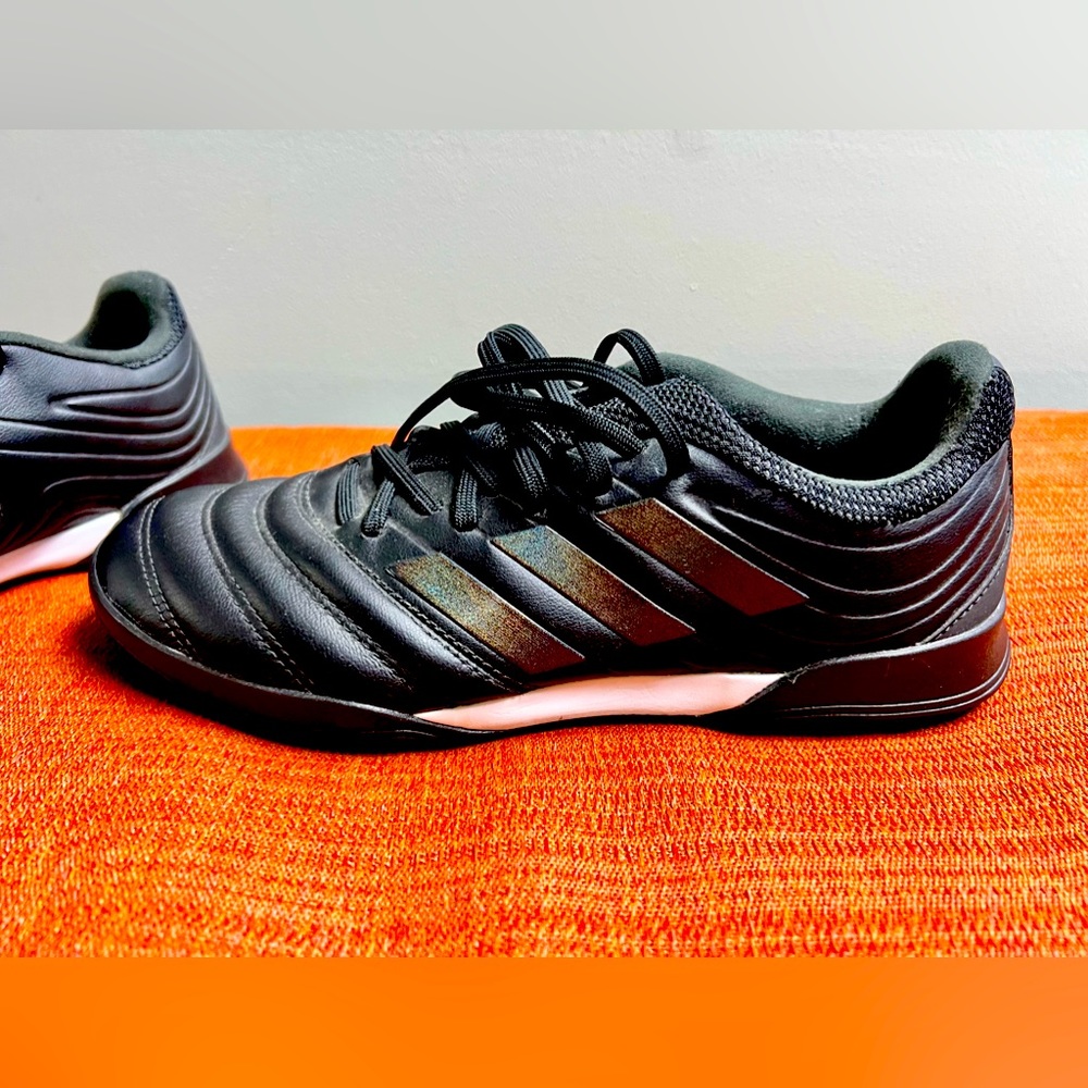 Adidas turf soccer cleats.